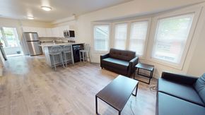 Ann Arbor apartment for rent - A kitchen with a refrigerator, microwave, and oven.