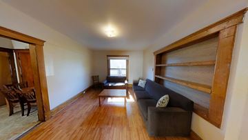 Ann Arbor house for rent - A living room with a couch and a chair.