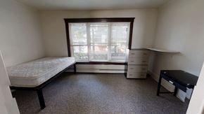 Ann Arbor apartment for rent - A bedroom with a bed, dresser, and desk.