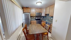 Ann Arbor apartment for rent - A kitchen with a table and chairs.