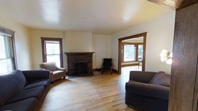 Ann Arbor apartment for rent - A living room with a fireplace and a couch.