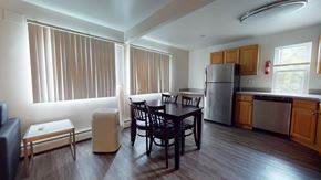 Ann Arbor apartment for rent - A kitchen with a table and chairs in the middle of the room.