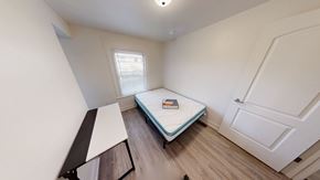 Ann Arbor apartment for rent - A small bedroom with a single bed and a window.