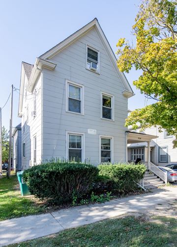 Ann Arbor apartment for rent - A two-story house with a grey exterior and a white trim.