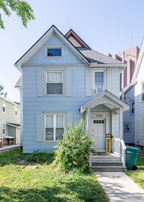 Ann Arbor apartment for rent - A blue house with a white door and windows.