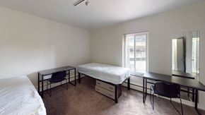Ann Arbor apartment for rent - A bedroom with a bed, desk, and chair.