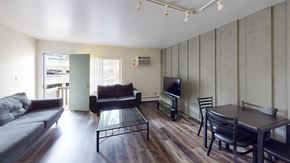 Ann Arbor apartment for rent - A living room with a couch, chair, and television.
