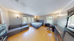 Ann Arbor apartment for rent - A room with a bed, a couch, and a chair.