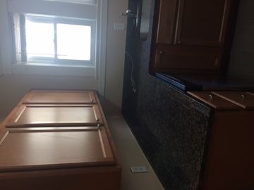 Ann Arbor apartment for rent - A kitchen with a wooden table and a window.