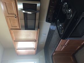 Ann Arbor apartment for rent - A black oven with a digital display is on the right side of the image.