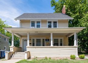 Ann Arbor apartment for rent - A two-story house with a front porch and a chimney.
