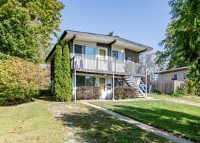 Ann Arbor triplex for rent - A house with a balcony and a staircase leading to the second floor.