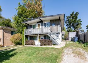 Ann Arbor triplex for rent - A two-story house with a balcony on the second floor.