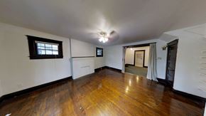 Ann Arbor apartment for rent - A room with wooden floors and white walls.