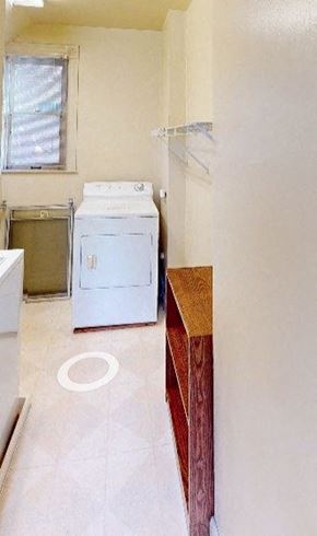Ann Arbor apartment for rent - A white washing machine and dryer in a laundry room.