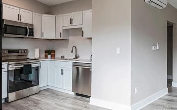 Ann Arbor apartment for rent - A kitchen with white cabinets and stainless steel appliances.