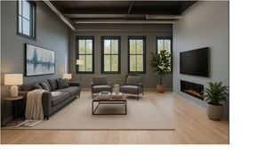 Ann Arbor apartment for rent - A modern living room with a grey sofa, a coffee table, and a fireplace.