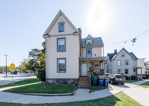 Ann Arbor apartment for rent - A two-story house with a front porch and a garage.