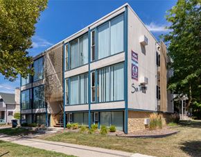 Ann Arbor apartment for rent - A modern building with a sign that says Sunrise on it.