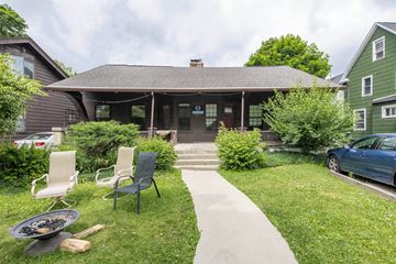Ann Arbor apartment for rent - A house with a patio and chairs.