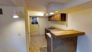 Ann Arbor apartment for rent - A kitchen with a counter and a sink.