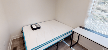 Ann Arbor apartment for rent - A small bedroom with a single bed and a window.