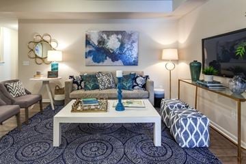 Saline apartment for rent - A living room with a white coffee table and a grey sofa.