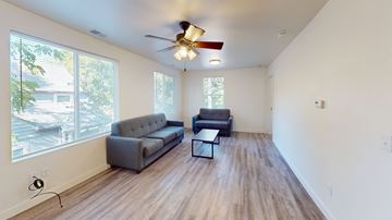 Ann Arbor apartment for rent - A living room with a grey couch and a black coffee table.