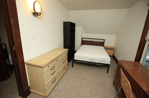 Ann Arbor apartment for rent - A bedroom with a bed, dresser, and a nightstand.