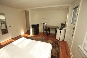 Ann Arbor apartment for rent - A bedroom with a bed, table and chairs.