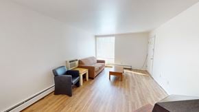 Ann Arbor apartment for rent - A living room with a couch, chair, and table.