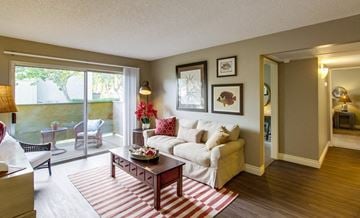 San Diego apartment for rent - a living room with a couch and a table