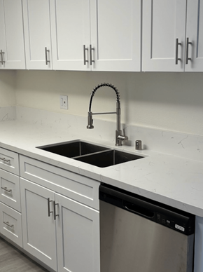 Santa Ana apartment for rent - A kitchen with a sink and a dishwasher.