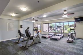Santa Ana apartment for rent - a gym with exercise machines and a window