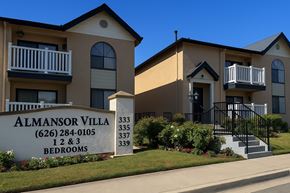 Alhambra apartment for rent - The image shows a building with the name Almansor Villa and a sign in front of it.