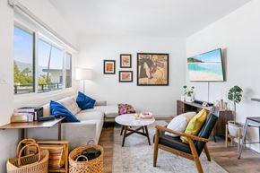 Pasadena apartment for rent - A living room with a couch, chair, and a television.