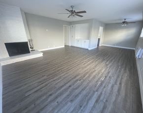 Arcadia apartment for rent - Atlas Arcadia large living room with fireplace,  wood floors and a ceiling fan
