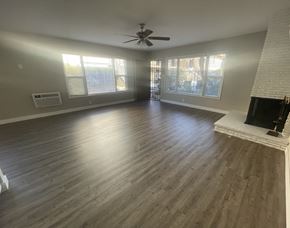 Arcadia apartment for rent - an empty living room with wood floors and a fireplace