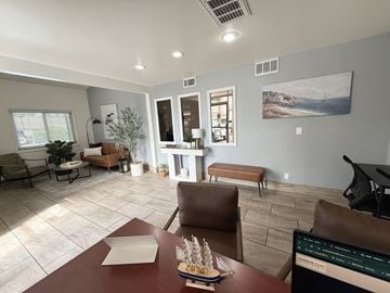 Anaheim apartment for rent - A living room with a brown table and chairs.