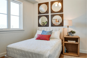 Los Angeles apartment for rent - a bedroom with a white bed and mirrors on the wall