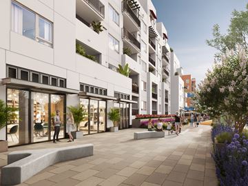 Santa Cruz townhouse for rent - A modern building with a white facade and balconies with plants on them.