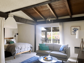 Westminster apartment for rent - A bedroom with a bed, a couch, and a table.