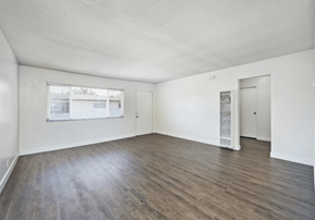 Loma Linda apartment for rent - the living room of an apartment with wood flooring and a window