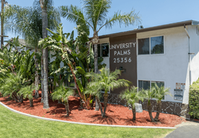Loma Linda apartment for rent - a building with palm trees in front of it