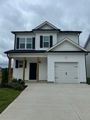 Clayton apartment for rent - A two-story house with a white garage door.
