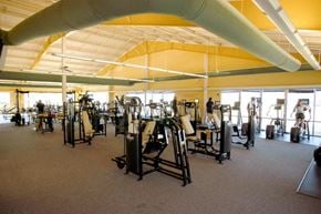 Clayton apartment for rent - a large gym with a lot of exercise equipment