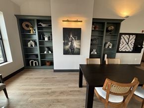 Brewster apartment for rent - a dining room with a table and chairs and a bookshelf