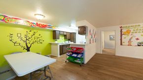 Houston apartment for rent - a dining room and kitchen with a table and a refrigerator