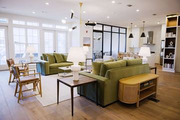 Jackson apartment for rent - A living room with a green couch and a wooden table.