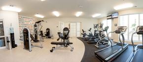 Jackson apartment for rent - a gym with various pieces of exercise equipment